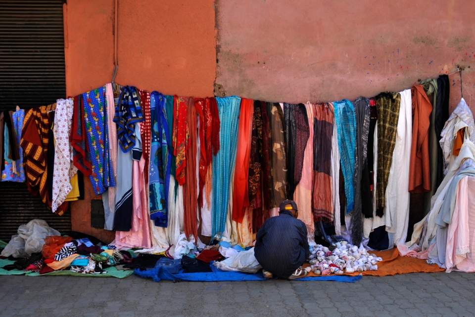 Garment-seller, Morocco - Image by Kristian Bertel