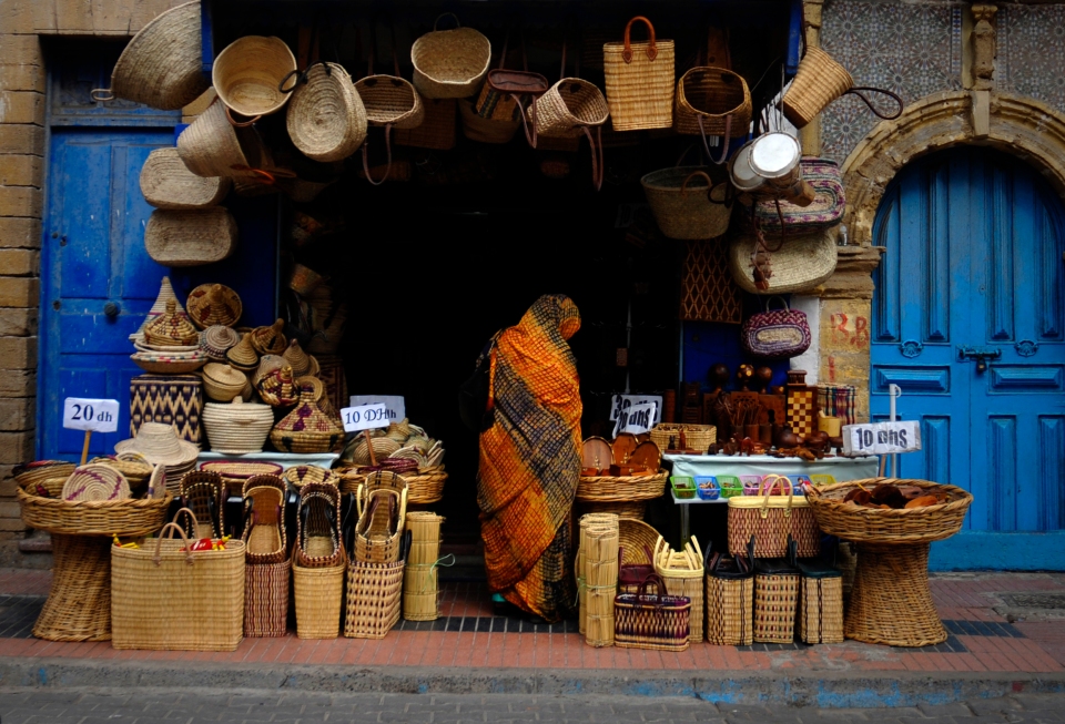 Woman in shop, Morocco - Image by Kristian Bertel