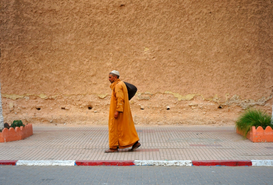 Man in orange, Morocco - Image by Kristian Bertel