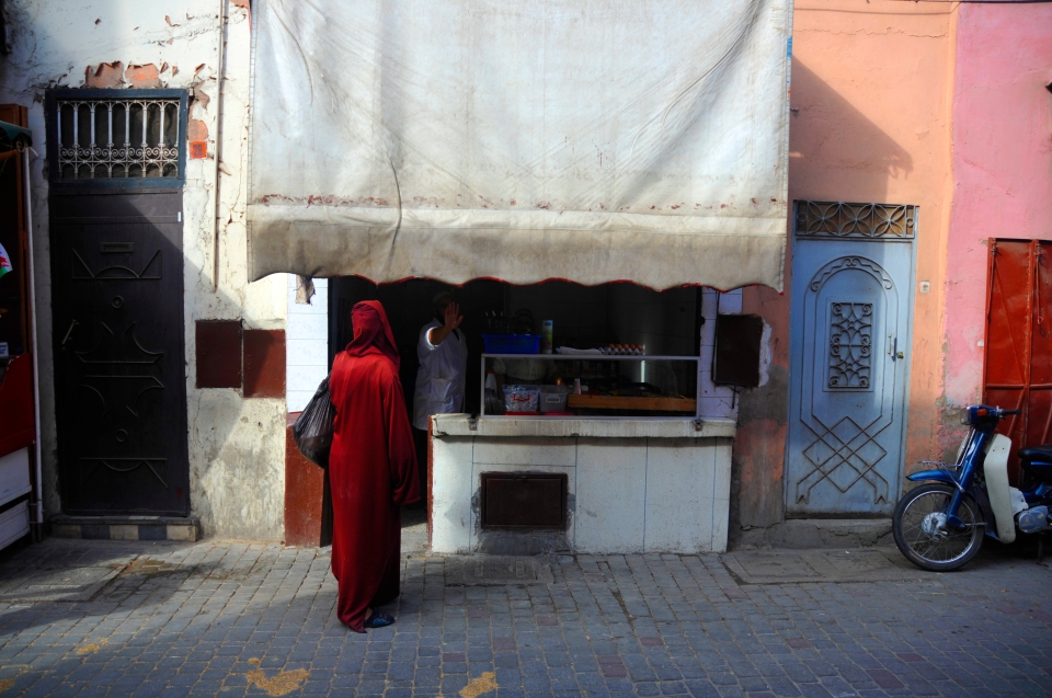 Woman in red, Morocco - Image by Kristian Bertel